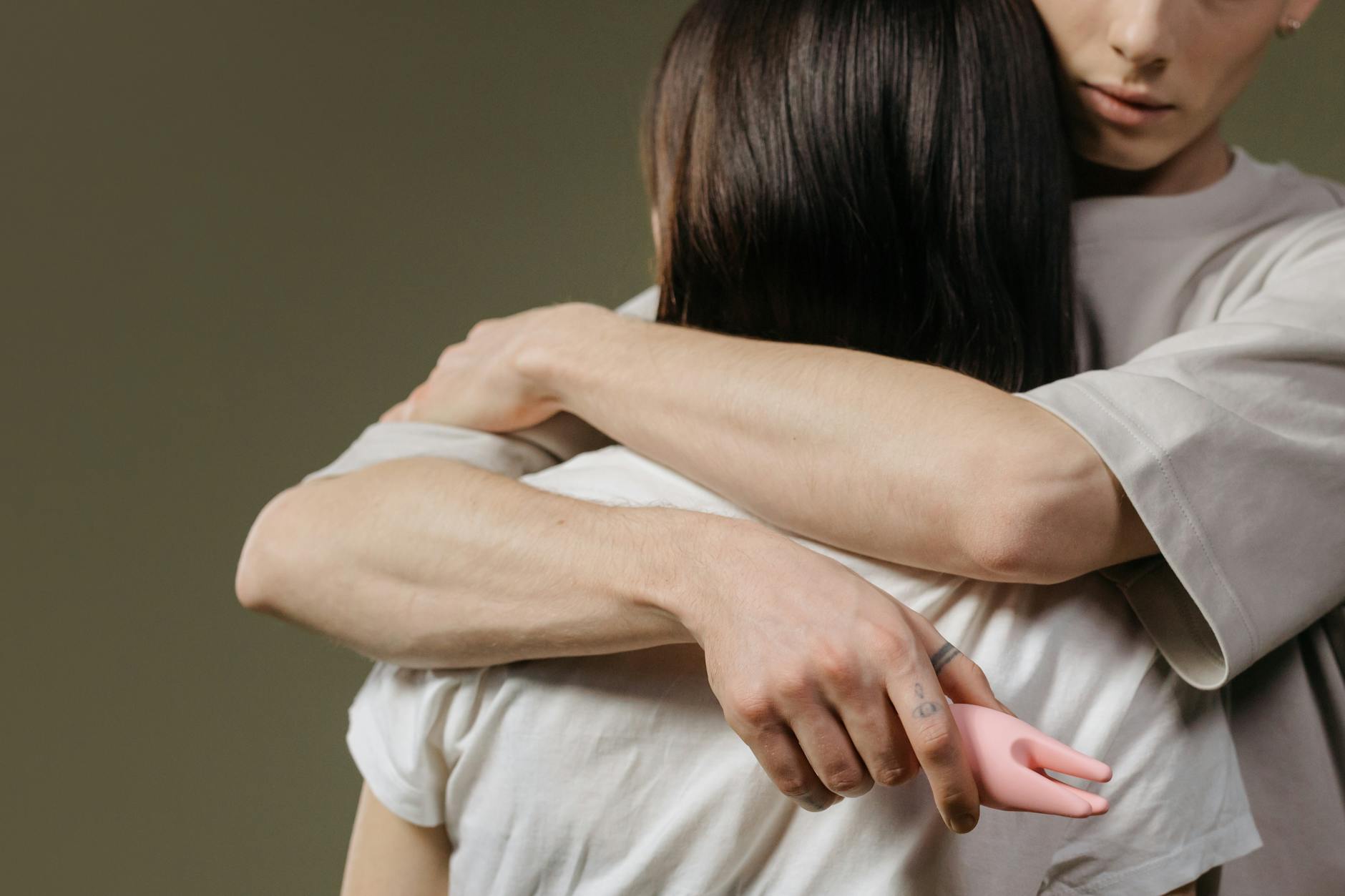 Close-up of a couple embracing, highlighting intimacy and connection after childbirth