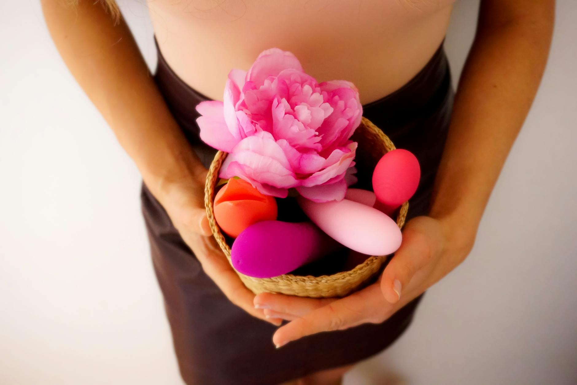 Colorful lemon clitoral vibrators and pleasure devices arranged on a bright yellow surface
